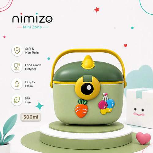 A nimizo Mini Zone 500ml mini food container in sage green and yellow, decorated with cute cartoon carrot and cherry magnets, displayed on a white and green pedestal with product feature icons on a light background.