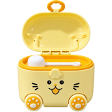 A yellow plastic baby feeding container with a cute cartoon face and wheels, shown open with a white spoon inside.
